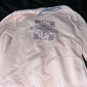 pink sweater with a blue collar.Very soft on the inside